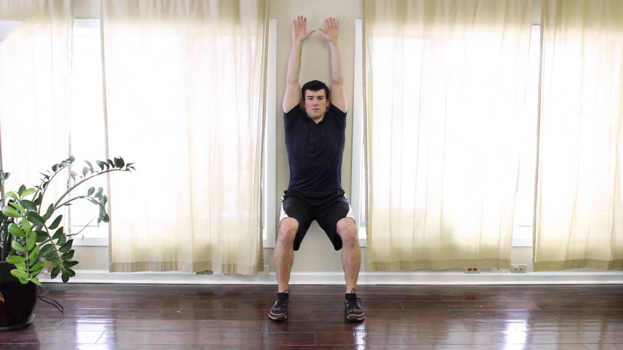 Wall Sit with Arm Rise - YouTube