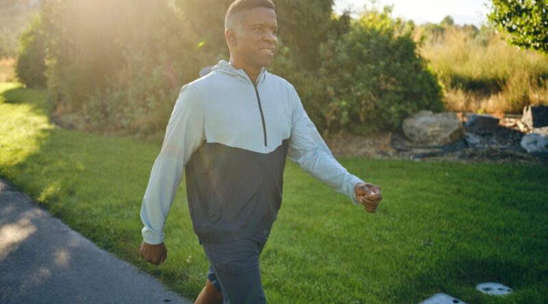 an elderly man exercising in the park in the morning